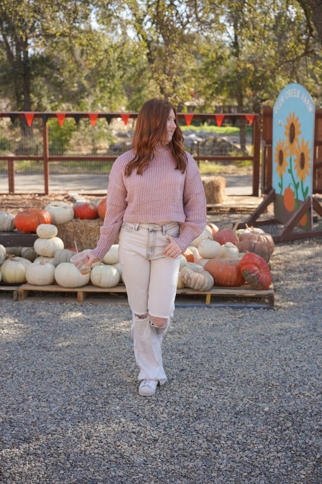 Fall outfit with a Lilac sweater turtleneck paired with light distressed jeans