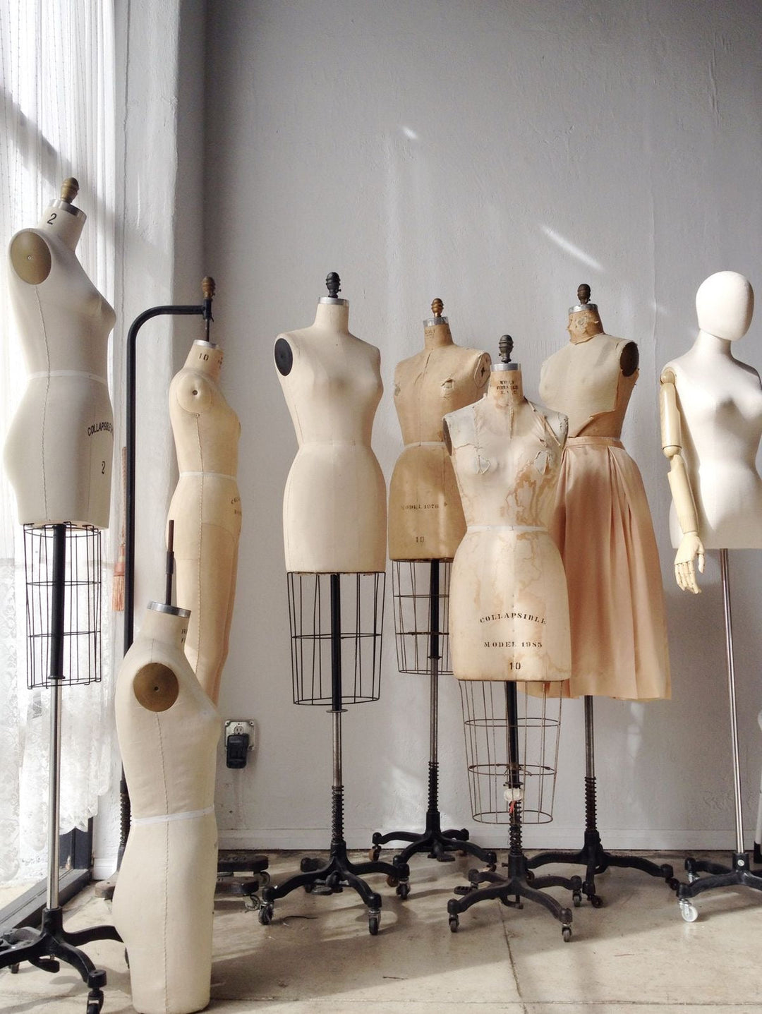 Women working on a mood board for her timeless fashion brand