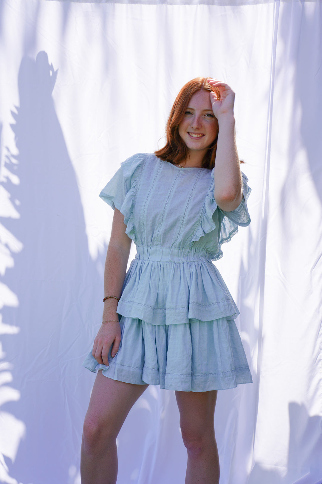 Women wearing blue ruffle dress