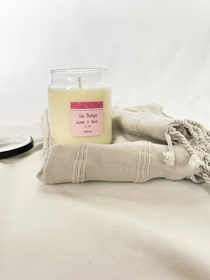 jasmine scented soy candle with grey tea towel