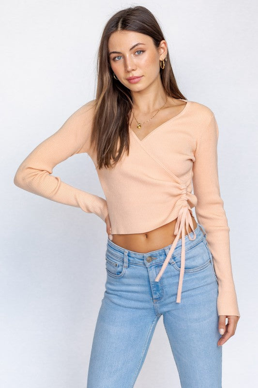 Front wrap long sleeve apricot pink color top. 