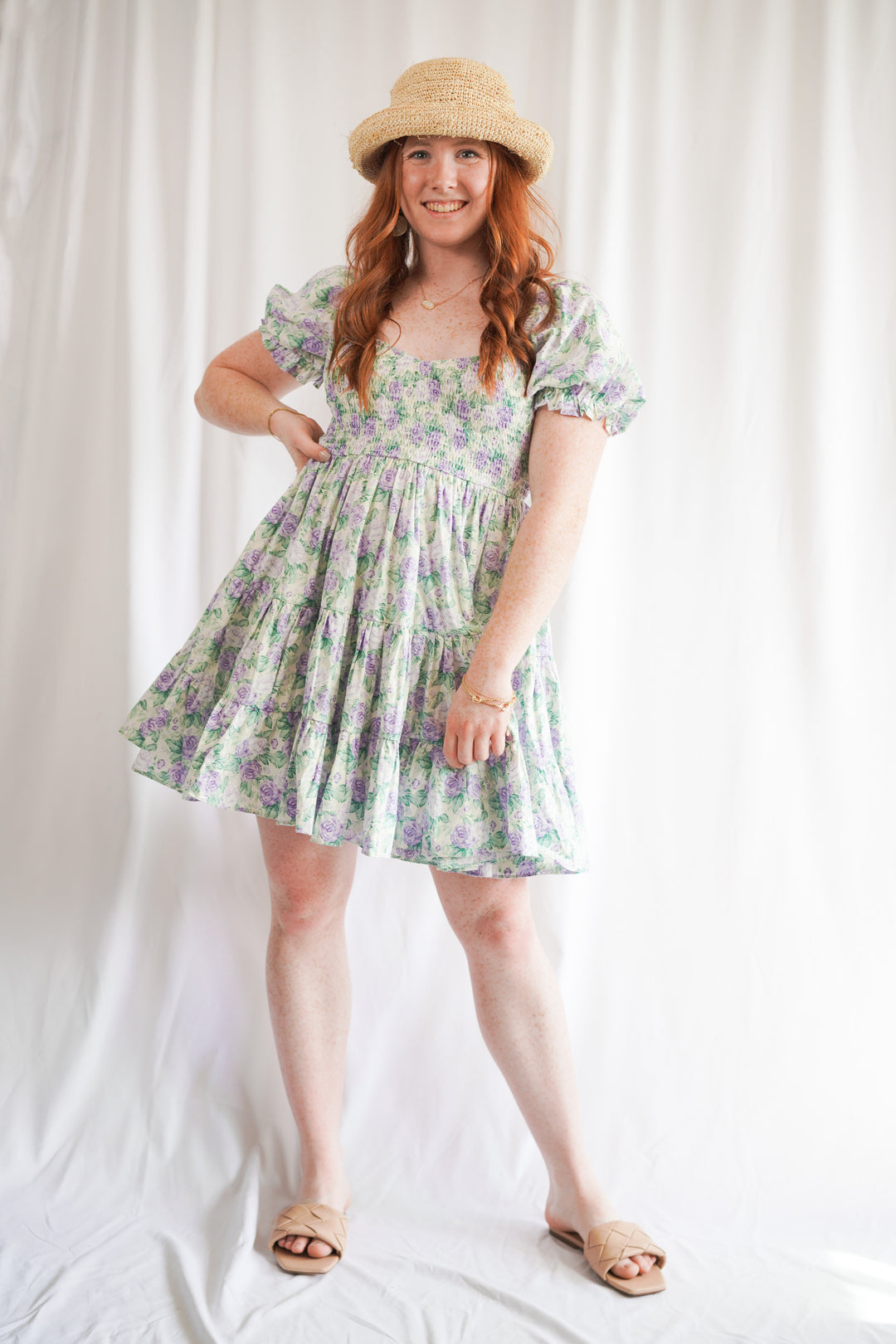 floral babydoll dress with short sleeves, ruffle tiers, and a smocked bust