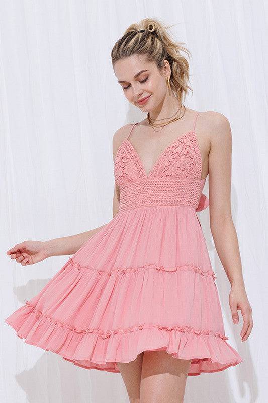 Pink, lace bralette top dress, adjustable spaghetti straps and an open back that ties in a bow. 