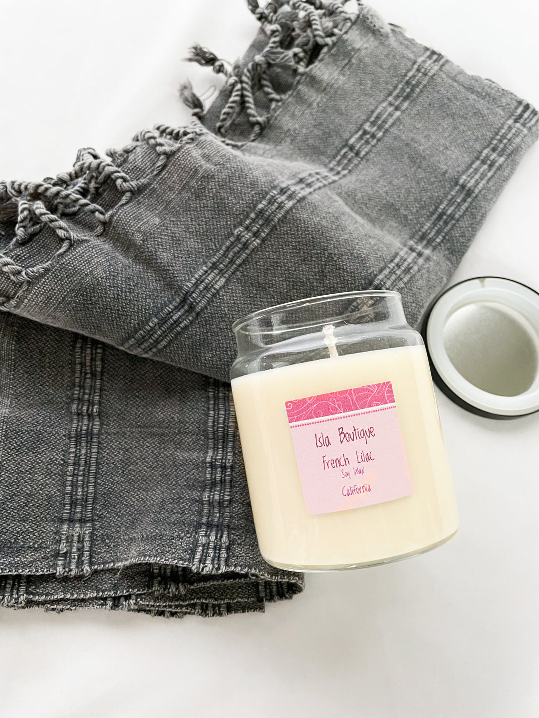 french lilac scented soy candle with grey tea towel