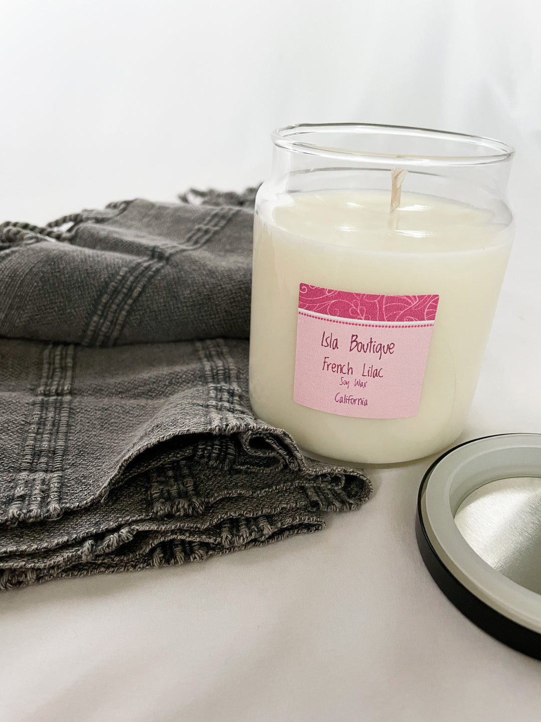 french lilac scented soy candle with grey tea towel