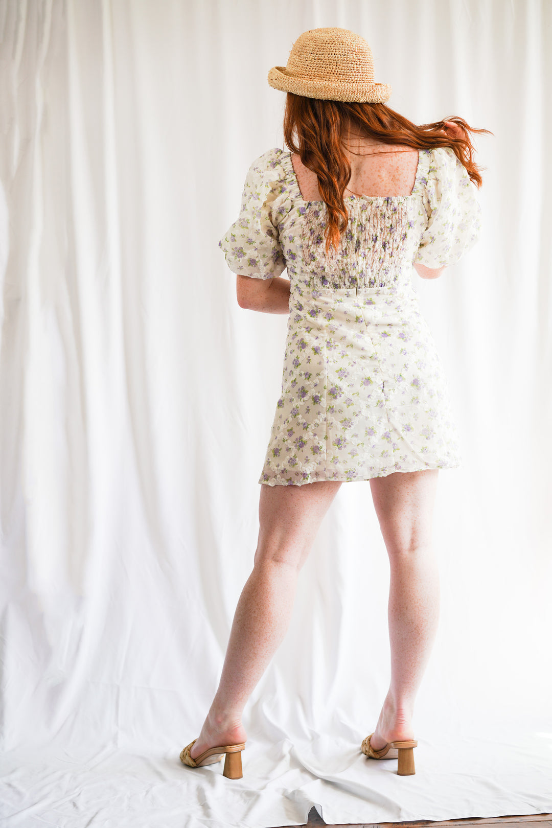 embroidered floral mini dress is fitted, has short puff sleeves and a smocked back for a flattering fit