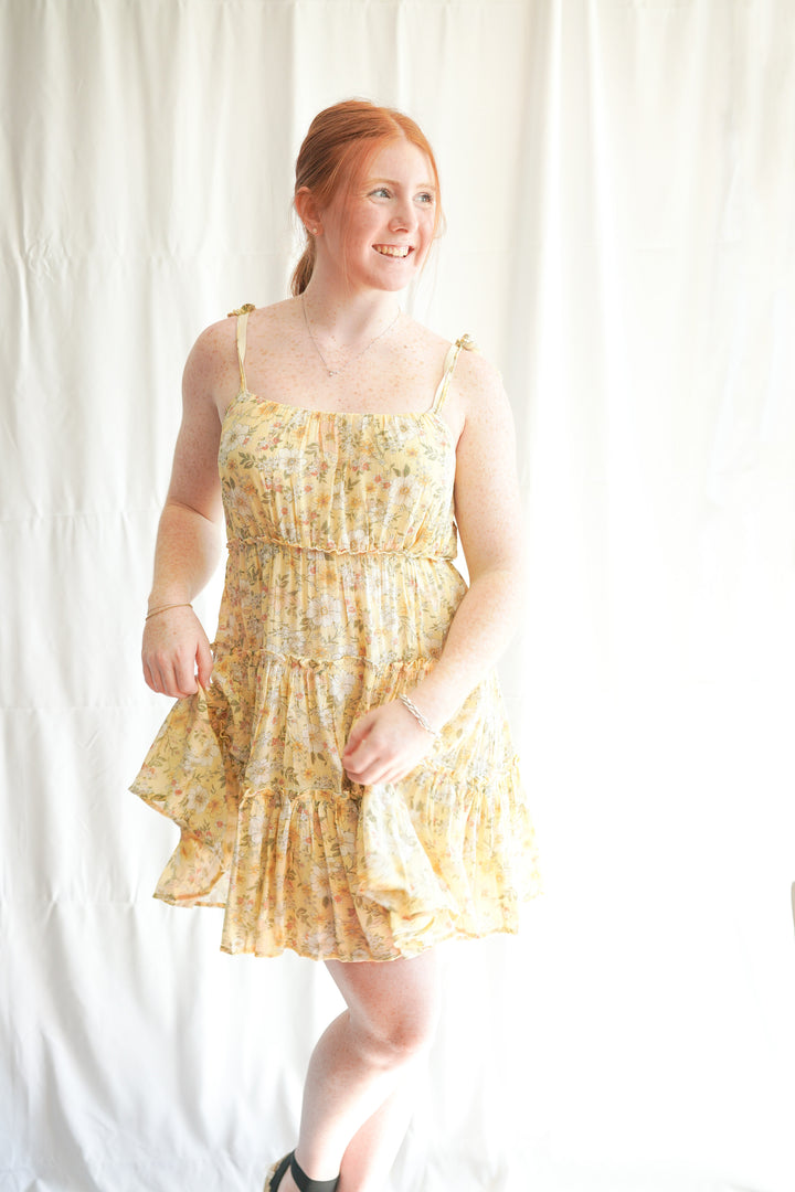 yellow tiered dress With a ruffle hem and thin tie straps