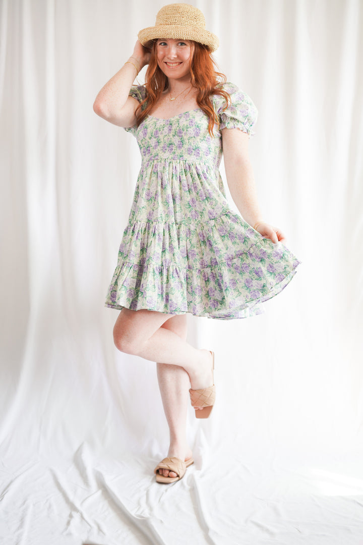 floral babydoll dress with short sleeves, ruffle tiers, and a smocked bust
