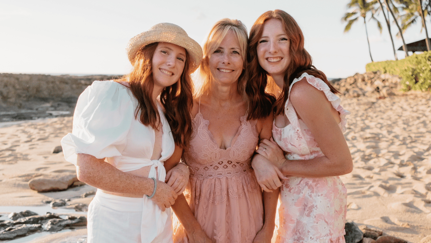 Mom and two girls on a beach in Hawaii